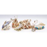 A collection of Royal Crown Derby paperweights, all with gold stoppers including a song thrush,