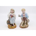 A pair of KPM figural vases, one of a boy, the other of a girl.