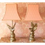 A pair of reproduction Empire style brass eagle table lamps,