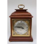 A 20th Century Elliott mantel clock by Mappin & Webb Ltd, round silvered dial and chapter ring,