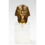 A silver gilt miniature Tutankhamun, London 1972 on a crystal type stand, complete with box