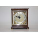 An Elliot mantel clock, mahogany case, silvered dial and gilt spandrels, mid 20th Century