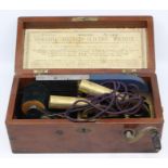 An early 20th century boxed medical Electro Device, contained within mahogany box, dated on label