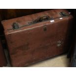 A vintage leather bound trunk style suitcase, circa 1930s