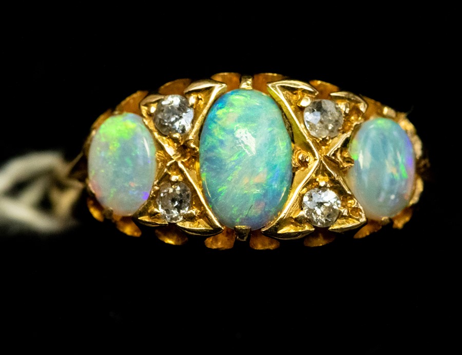 A Victorian opal and diamond ring 18ct gold, comprising three oval opals with alternate diamond - Image 3 of 4