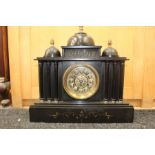 A 19th Century eight day slate mantel clock, with key