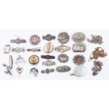 A collection of silver Victorian and early 20th Century silver, white metal and gilt sweetheart