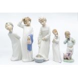 Five Nao figures of young children ready for bed