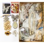 A large collection of costume jewellery to include 1920's/30's glass necklaces, vintage paste set
