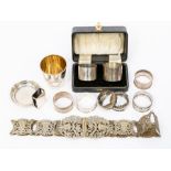 A collection of silver to include two mismatched silver napkin rings cased, six others, along with a