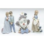 Lladro still life of a clown with two Nao figures of young adults