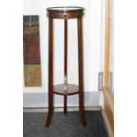 A late Victorian / early 20th Century oak jardiniere stand, height 95cm