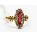 A stone set 9ct gold ring, set to the centre with red stone possibly tourmaline within a border of