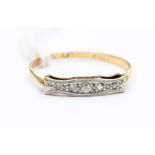 An Edwardian 18ct gold and diamond set ring, set to the top with five small diamonds, platinum