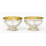 A pair of George III bonbon dishes, gilt liner, repousse floral decoration, London 1806, maker marks