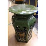 A Chinese floor standing ceramic garden seat, green glaze and 48cms high approx