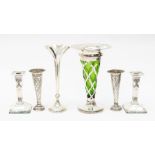 A collection of silver to include: A pair of Edwardian Neo-Classical style desk candlesticks, by