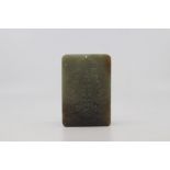 A mid mottled green and russet jade archaistic pendant plaque, probably Republic period, of