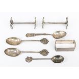 A collection of silver items including spoons, knife rests and a napkin ring (Q)