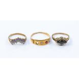 Three various 9ct gold rings, comprising a diamond and ruby ring, missing a stone, a three stone