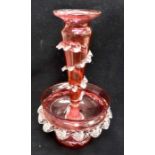 A Victorian cranberry glass epergne centerpiece, made from two sections, with wavy edges, a