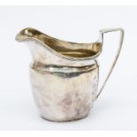 A George III silver helmet shaped cream jug, plain body with reeded rim, London, 1805 maker's mark