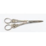 A pair of silver Georgian grape scissors, grape and vine decoration to handles, London 1816, William