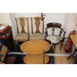A collection of furniture, comprising a pair of Georgian style oak dining chairs, an Edwardian