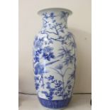 A large Chinese blue and white floor standing vase, probably 19th Century, hand painted with birds