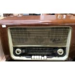 A 1950's Bush walnut cased radio, with Long, medium and short wave plus VHF. (Rear panel loose),(