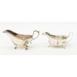 A Georgian style silver sauceboat, beaded rim on three acanthus and scroll feet, by James Dixon &
