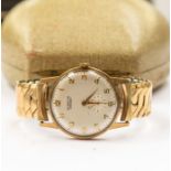 A gents 9ct gold Everite wristwatch, round champagne dial, with gold tone number markers, approx