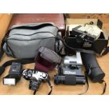 A collection of assorted cameras comprising Sanyko 8cm camera with lens, Bell & Howell lens with