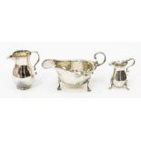 A silver Asprey & Co sauce boat  London1834, along with a miniature baluster shaped cream jug,