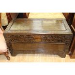 A mid 20th Century Chinese carved hardwood camphor chest, the lid opening to reveal a fitted