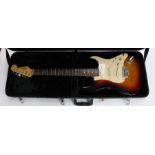 A vintage, Squier Strat by Fender, electric guitar, complete in Gator case, six string, Serial