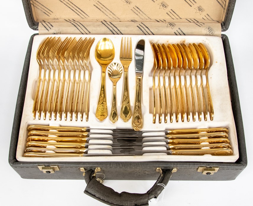 A Bestecke Solingen 12 place canteen of cutlery, gold plated and stainless steel, the case having