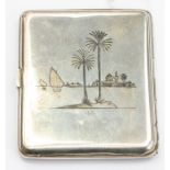 A white metal Eastern cigarette case, filigree front, engraved back, depicting palm trees, 4.76ozt