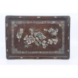A Chinese inlaid rosewood tray, 19th Century, of rectangular form, inlaid and decorated with peonies
