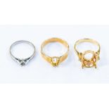 Two 18ct gold claw set ring mounts, to include one with diamond set shoulders, size M and a mount