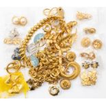 A collection of designer gilt metal costume jewellery to include a Christian Dior bow brooch,