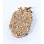A 9ct rose gold pendant locket, rectangular form with floral and scroll  engraved decoration to