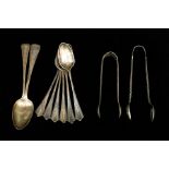 A set of six Edwardian silver coffee spoons, with a pair of sugar tongs, Sheffield 1901, together