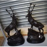 Tw large bronzed spelter Monarch of the Glen stag figures, 20th Century, each bearing a signature