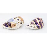 Two Royal Crown Derby paperweights including a hedgehog and an owl, both silver stoppers, no boxes