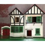 A 1960's doll house with furnishings
