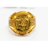 A gents 22ct gold signet ring, embossed emblem, 12.53grams approx