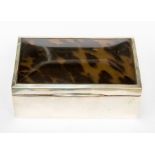 A George V plain silver cigarette box with silver mounted tortoiseshell cover, by London 1921,