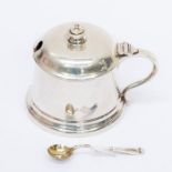 A George VI large silver tankard shaped mustard pot and cover, with blue glass liner and