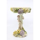 Dresden porcelain table centrepiece with cherub holding pierced bowl, floral decoration. Height